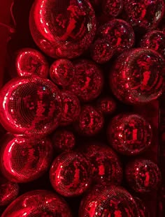 red disco balls are stacked on top of each other