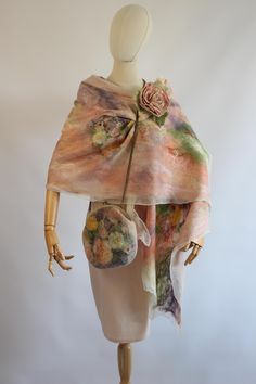 a mannequin wearing a scarf with flowers on it