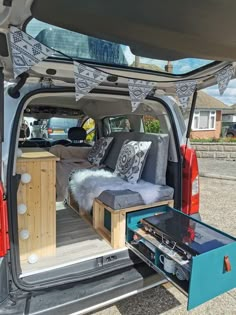 the back end of a van filled with furniture