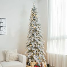 a white christmas tree in a living room