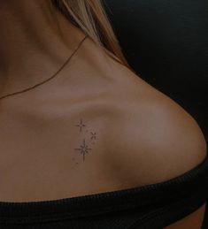 a woman with a cross tattoo on her chest