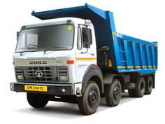 a white and blue dump truck on a white background