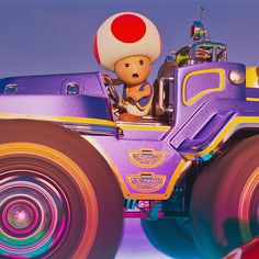 a cartoon character riding on the back of a purple truck with big wheels and a mushroom hat