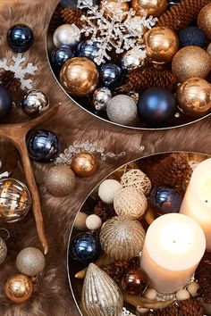 two plates filled with christmas ornaments and candles