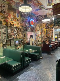 the inside of a restaurant with green booths