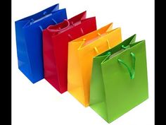 four different colored shopping bags with handles