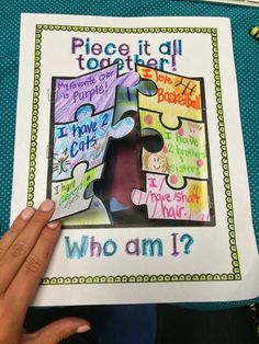 someone holding up a puzzle piece with the words who am i?