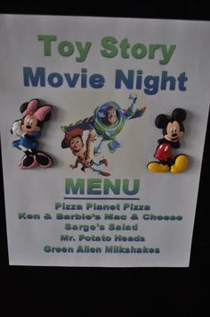 a sign advertising toy story movie night with mickey mouse and friends