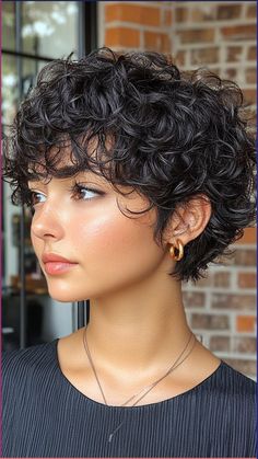 Rock a Curly Pixie Cut that’s perfect for round faces, offering a chic and playful look. This cut showcases your curls with a modern, easy-to-maintain style. Click the pin and follow us for more curly hair inspiration! #CurlyPixieCut #RoundFaceStyles #ChicCurls #HairInspo #PixieCut Curly And Short Hairstyles, Circle Face Hairstyles Short, Short Haircuts For Mixed Curly Hair, Chic Short Curly Hair, Perm On Pixie Hair, Short Curly Hairstyles Older Women, Curly Hair Very Short, Pixie On Curly Hair, Pixie Haircut For Round Faces Curly