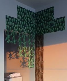 a bedroom with a bed and a tree made out of pixelated squares on the wall