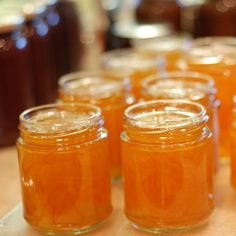 several jars filled with liquid sitting on top of a table