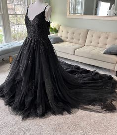 This dress has the perfect volume ( not too huge, not too minimal ). It also has a sexy deep v-neckline, lace appliqued on black tulle for the bodice and skirt in addition to bling tulle for the skirt for a subtle sparkly look.All of our gowns are created from scratch, so we will be creating the dress in your custom size.

To see the video of this gown on our instagram , check it out here https://www.instagram.com/p/Ck_gBCQLswe/
https://www.instagram.com/p/ClKPFN2rpvy/

Follow @bridesandtailor o Black Wedding Dress Ballgown, Gothic Wedding Dress Black, V Neckline Wedding Dress, Black Bridal Gown, Wedding Dress Gothic, Wedding Dress Ballgown, Wedding Ballgown, Black Lace Wedding Dress, Black Wedding Dress Gothic