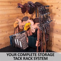 a horse tack rack with saddles and other accessories