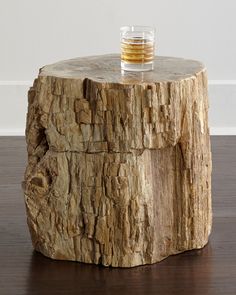 a glass on top of a wooden table with wood grain patterning around the edge