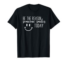 a black t - shirt that says be the reason someone smiles today with a smiley face