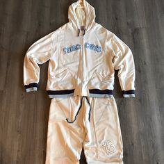 Vintage Mecca Sweat Suit Cream Blue Navy Mens Xl. This Is A Rare Set From The History In Urban Clothing Apparel By The Brand Mecca. I Have Personally Owned This Zip Up Hoodie And Jogger Set Since The Late 90’s It Has Been Tucked Away With Some Other Items From That Era. I Had Considered Having The Pants Sewn Into Elastic Cuffs At The Bottom. This Is Almost Mint Condition Set Only Some Minor Wear. Own A Piece Of History. Ships Next Day. Pelle Pelle Fubu Gucci Yeezy Nike Adidas Tommy Hilfiger Jordan Casual Fitted Cream Sets, Fitted Cream Casual Sets, Casual Navy Tracksuit For Streetwear, Blue Sporty Tracksuit With Pockets, Navy Sporty Long Sleeve Tracksuit, Blue Sports Tracksuit With Pockets, Navy Sportswear Tracksuit, Sweat Suit, Urban Clothing