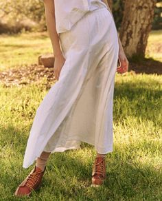 The Godet Skirt. takes cues from a 1930s gown, reimagined through our signature casual lens. The easy, pull-on skirt has an elasticated waistline with a top block that loosely flatters the hips while the godet insets add volume to the sweeping hemline. Style it back to The County Top. for a sweet and charming set. Summer Rayon Maxi Skirt With Elastic Waistband, Spring Maxi Skirt With Gathered Waist, Spring Daywear Long Skirt, Spring Long Gathered Skirt, Spring Bottoms With Gathered Waist For Day Out, Spring Rayon Maxi Skirt With Gathered Details, Flowy Rayon Midi Skirt, Spring Relaxed Maxi Skirt With Gathered Waist, Chic Flowy Gathered Skirt Bottoms