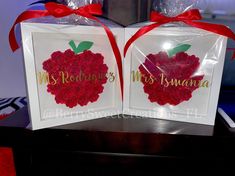 two greeting cards with red roses in the shape of an apple on top of each other