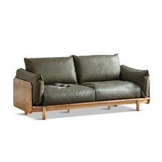 a green leather couch with wooden legs and arm rests on a white background, it appears to be empty