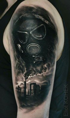 a man with a gas mask tattoo on his arm