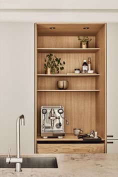 an open bookcase with various items on it