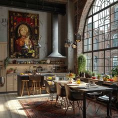 an industrial kitchen with large windows and lots of natural light coming in from the window