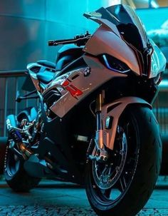 a silver motorcycle parked in front of a building