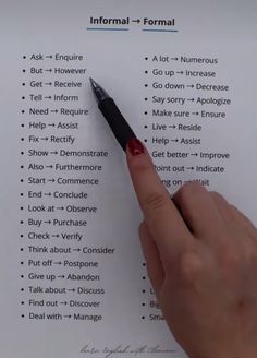 a hand holding a pen over a sheet of paper that has information on it and the word formal written in red