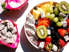 two bowls filled with different types of fruit