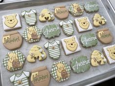 baby shower cookies are arranged on a baking sheet to look like they have teddy bears