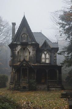 an old abandoned house in the foggy woods