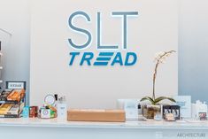 there is a counter with items on it and a sign that says slt tread