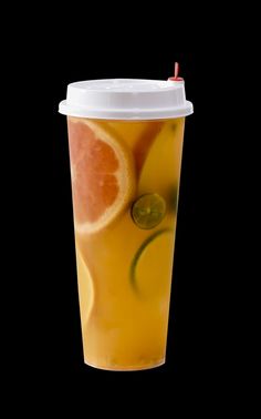 a cup filled with lemonade and orange slices