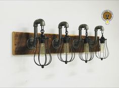 five light fixtures mounted on a wall