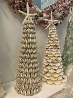 three seashell christmas trees are on display