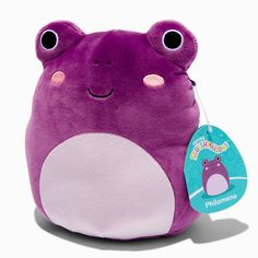 a purple stuffed animal with big eyes and a tag on it's back end