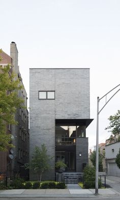 the house is made out of concrete and has two levels that are connected to each other