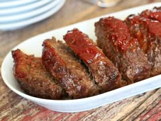 two meatloafs on a white plate with the words boston market meatloaf if you like this meatloaf, you'll love the hack