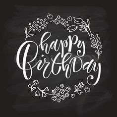 the words happy birthday written in white chalk on a blackboard with flowers and leaves