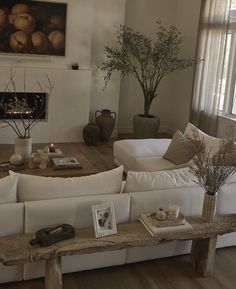 a living room filled with furniture and a fire place