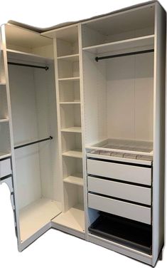 an open white closet with shelves and drawers