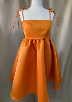 Orange dress Dress made of matt, high-quality satin fabric Long loops as straps Skirt length: 65 cm We also make dresses to your measurements :) Please contact if you have any further questions. Orange Flowy Dress Short, Summer Satin Dress For Dress-up Occasions, Sleeveless Solid Dresses With Satin Finish, Solid Color Summer Dress With Satin Finish, Orange Fairy Dress, Orange Puff Dress, Orange Fruit Dress, Orange Vintage A-line Dress, Elegant Orange A-line Mini Dress