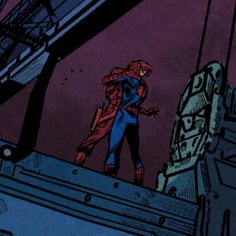 the spider - man is standing on top of a building with his arms around him