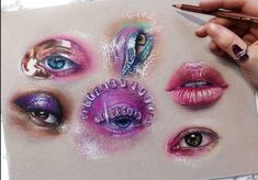 someone is holding a pencil and drawing on paper with their eyes painted in different colors