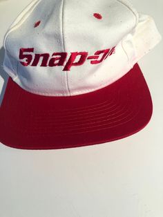 Snap-On White and Red Baseball Hat Adjustable  SnapBack There is some red face on the white along the brim and sides Purchase price includes free shipping in Canada and USA International shipping is available, please contact before purchase for shipping quote Any questions, just ask!  Vintage item, regular wear due to age should be expected Any known flaws/ markings will be listed No returns/ exchanges,  it please contact if there is an issue with your item Retro White Fitted Hat With Curved Brim, Vintage White Baseball Cap With Curved Brim, White Retro Adjustable Fitted Hat, Vintage White Fitted Hat With Curved Brim, White Vintage Fitted Hat With Curved Brim, White Adjustable Retro Fitted Hat, Vintage White Flat Brim Hat, Vintage Red Snapback Fitted Hat, White Retro Snapback Hat With Curved Brim