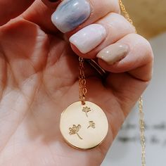 Adorable dandelion necklace features three dandelions hand stamped on the 19mm coin with a dainty chain. Smooth edges or hammered edges, you pick! Available in 14k gold fill or Sterling Silver. 18" or 20" inch length. If you would like to request a different length, please leave a note below. Classic Pearl Earrings, Dandelion Necklace, Shield Ring, Electronic Gifts, Hammered Gold, Coin Necklace, Hammered Silver, Hand Stamped, Gold Filled