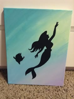 a painting of a mermaid with a fish on it's back and the silhouette of a cat