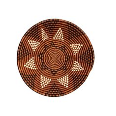 a brown and black basket with white designs on it