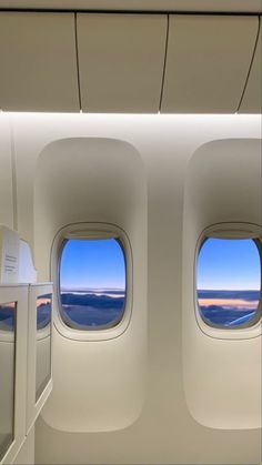 an airplane window looking out at the sky