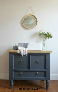 a blue dresser with the words build your own bathroom vanity